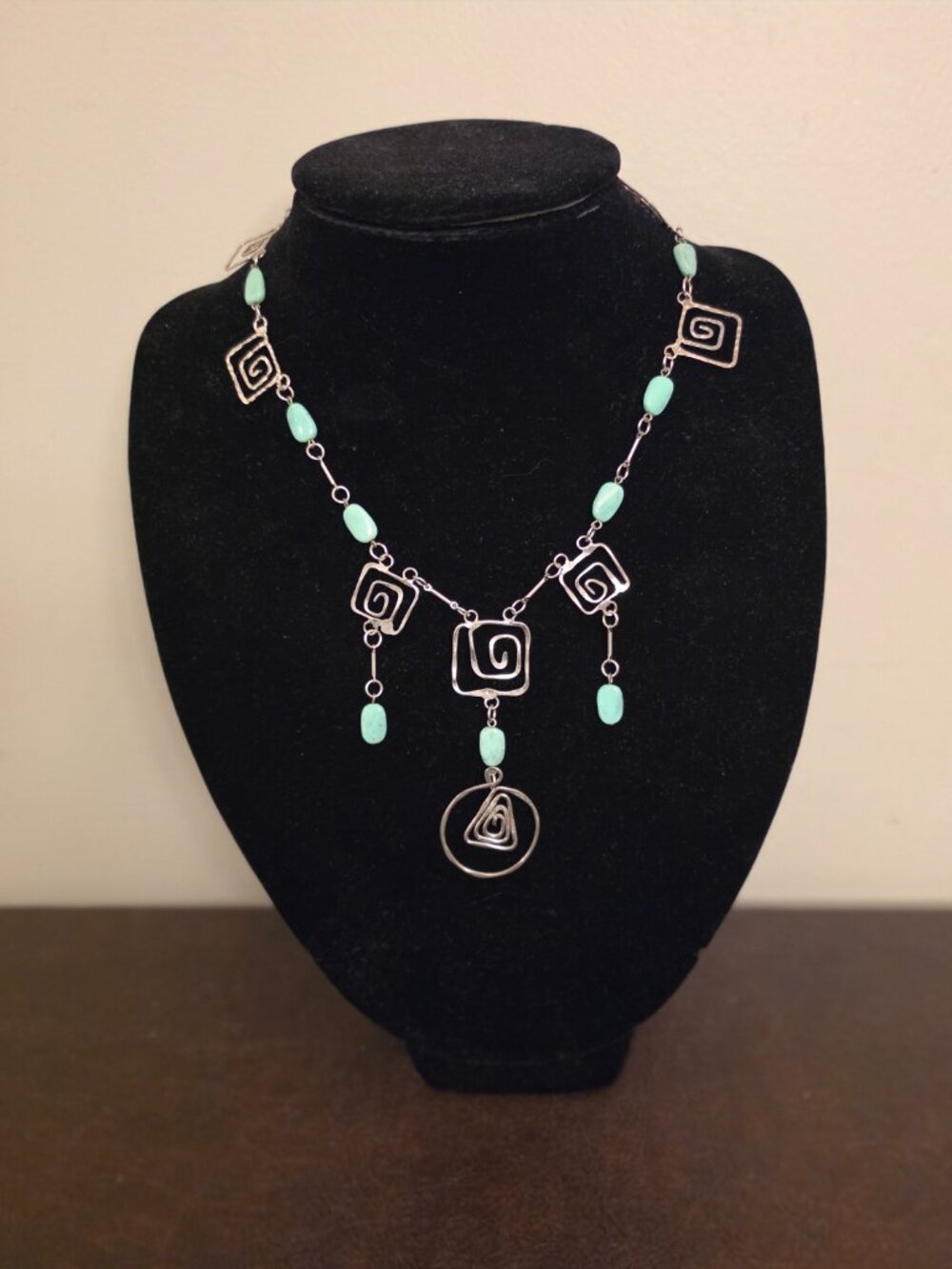Vintage Modernist Silver Tone Necklace features light green/blue composite stone